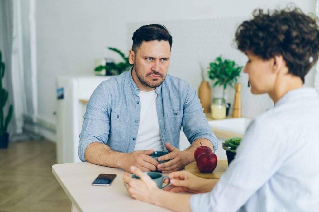 Two adults having a calm first conversation in a public café