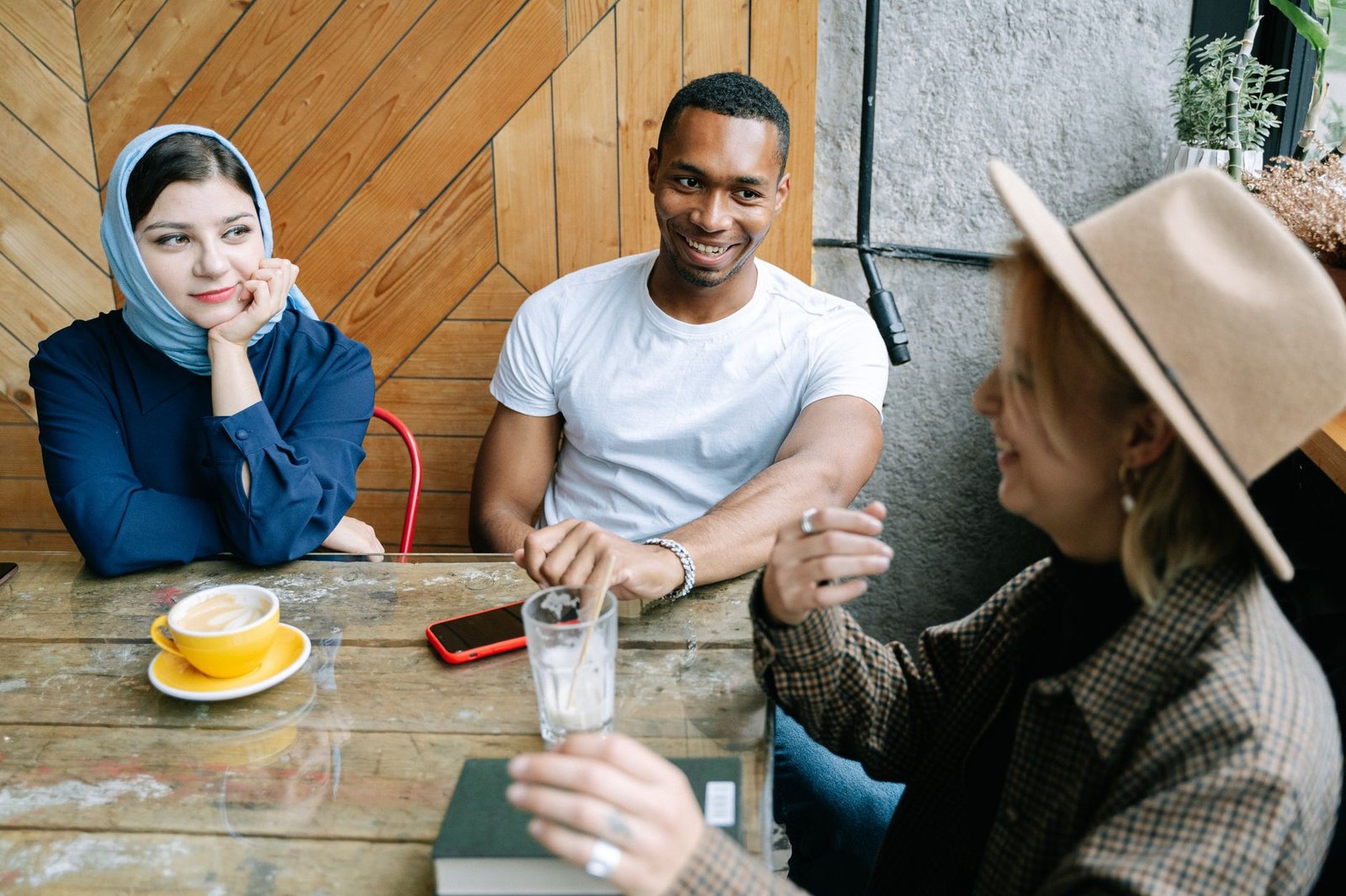 Two adults having a relaxed conversation in a Birmingham café