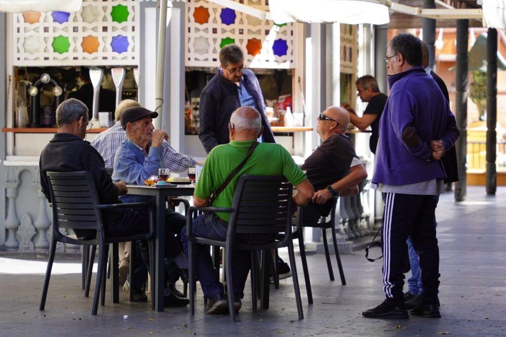 Adults meeting for coffee in a public venue