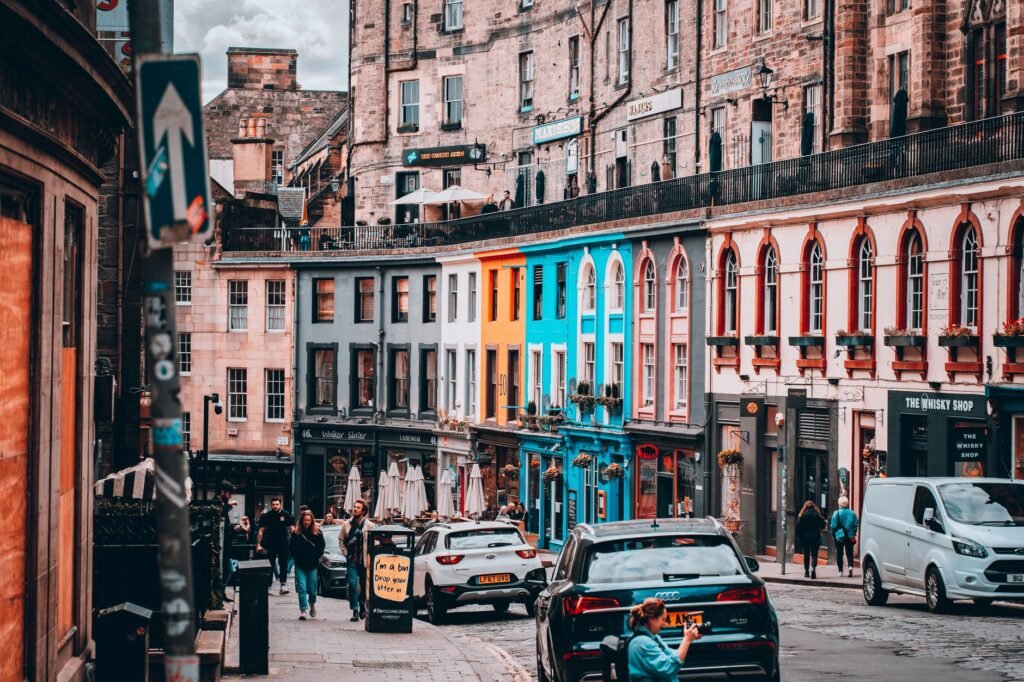 Adult walking through a well-lit Edinburgh street