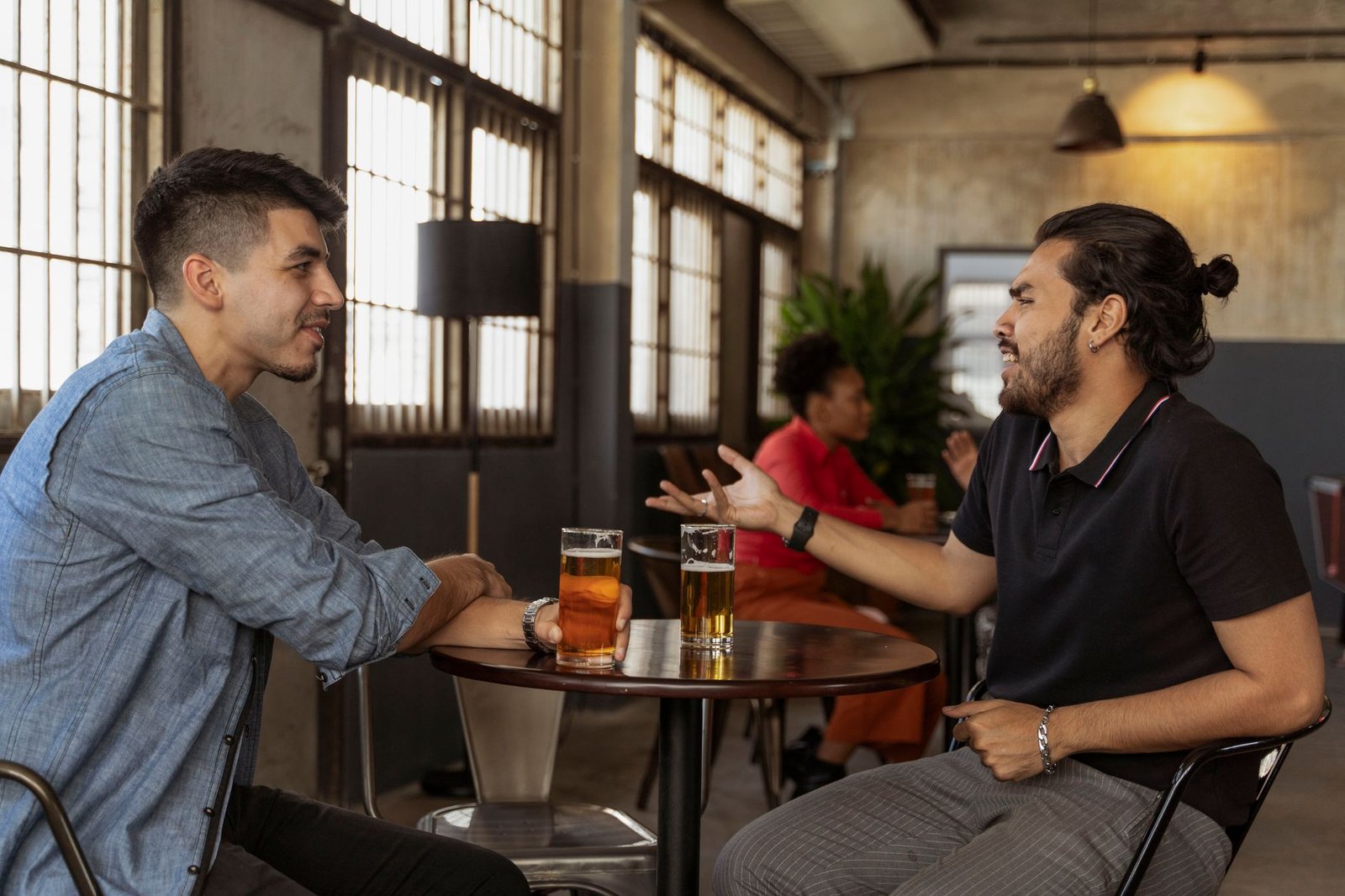Two adults having a respectful conversation in a Glasgow café