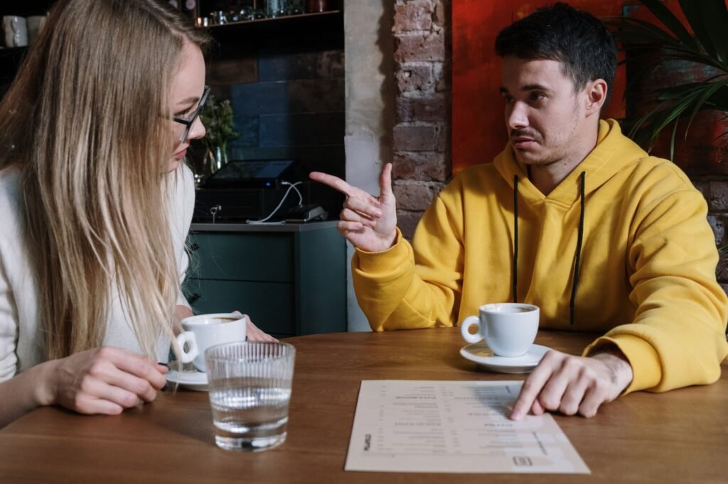 Adults discussing plans over coffee in a quiet cafe