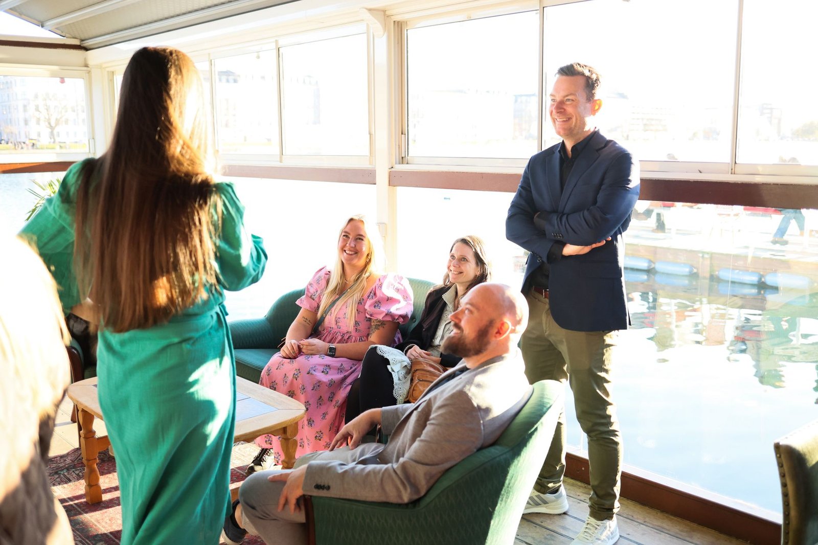 Two adults having a discreet conversation in a modern lounge