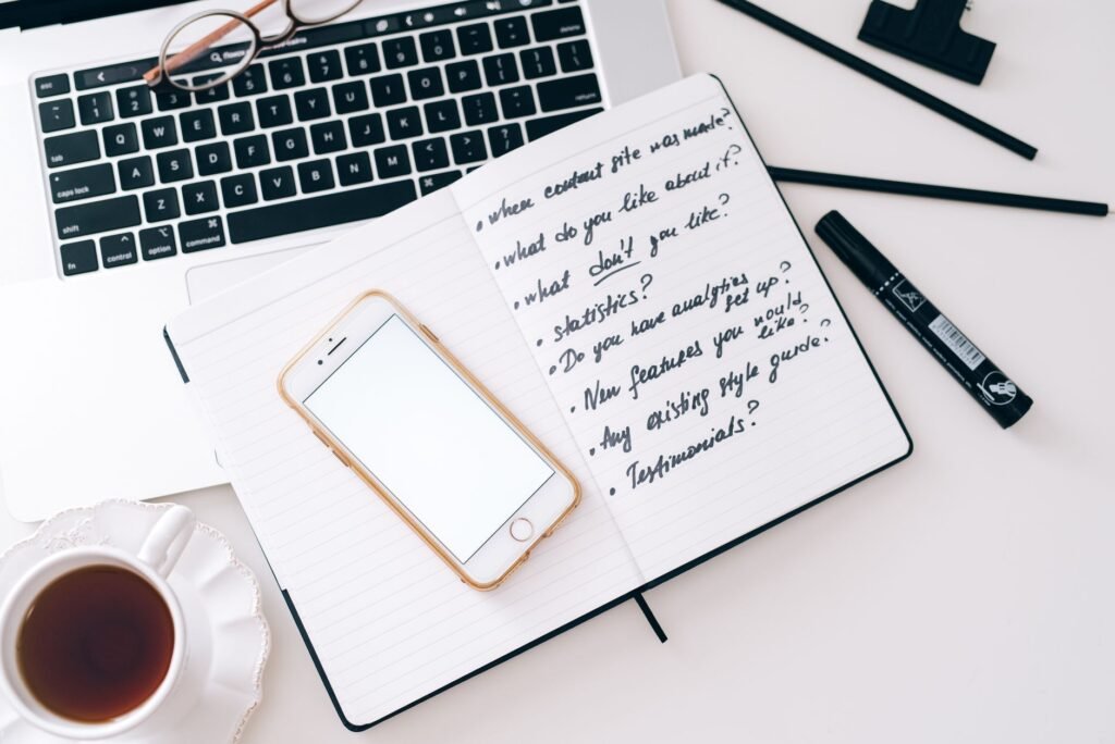A notebook and phone used to plan a considerate meeting