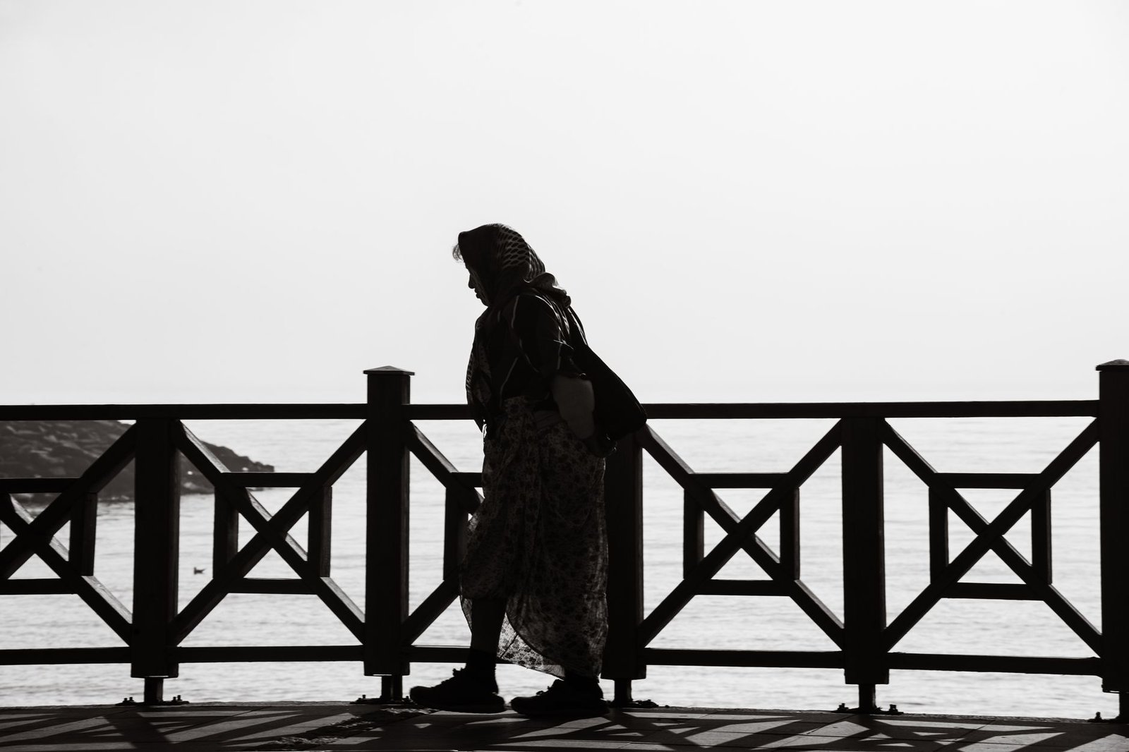 Adult woman walking along Torquay seafront