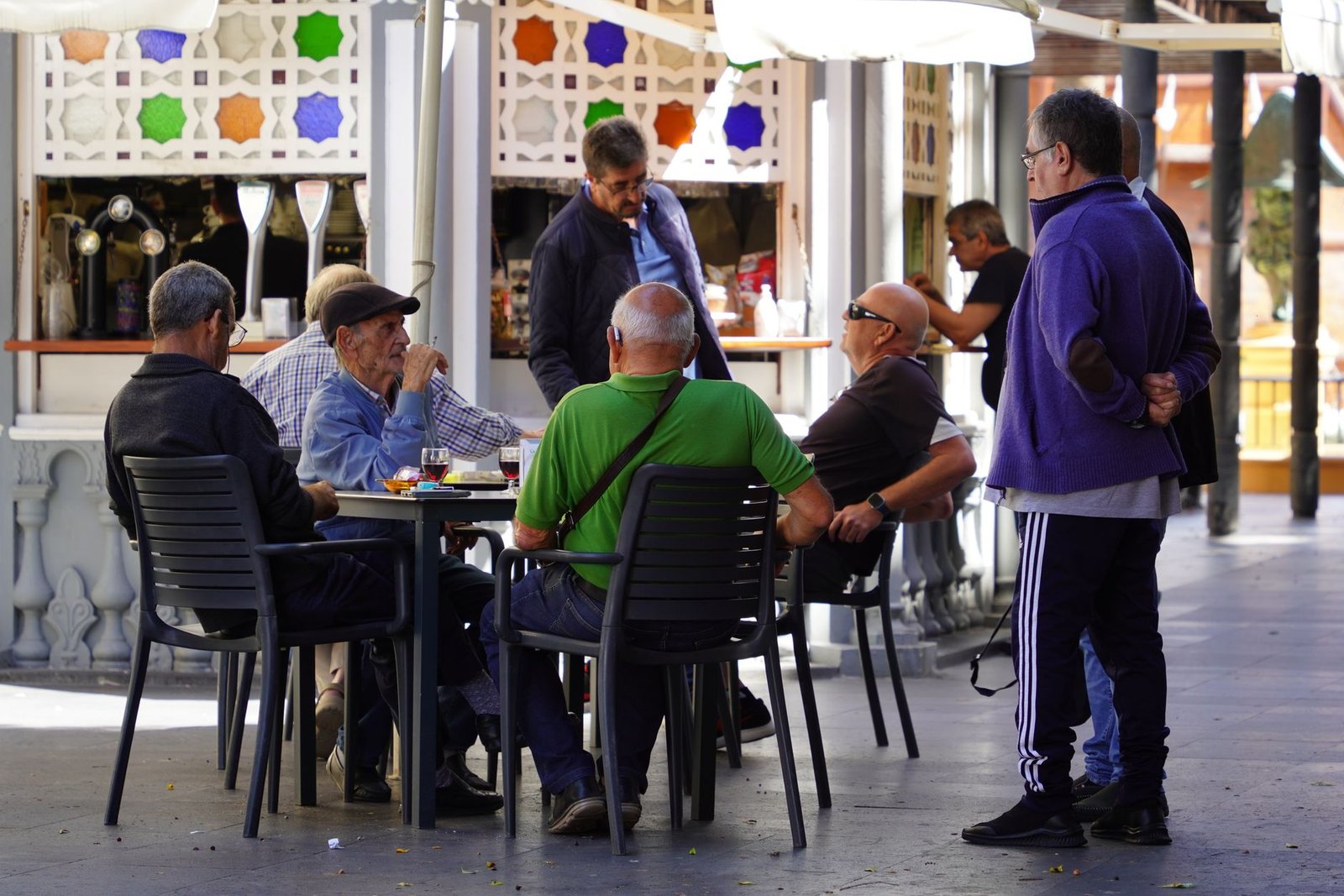 Adult person having a discreet conversation in a modern Warrington cafe