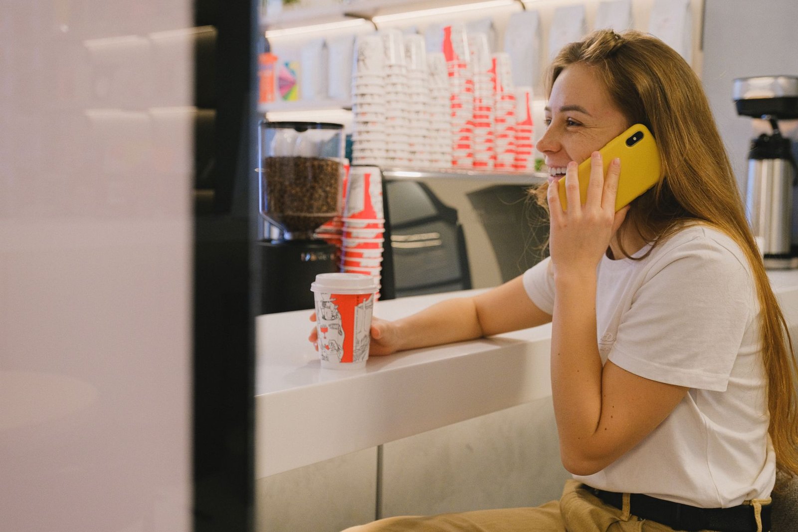 Adult reviewing messages discreetly at a quiet cafe in Wakefield