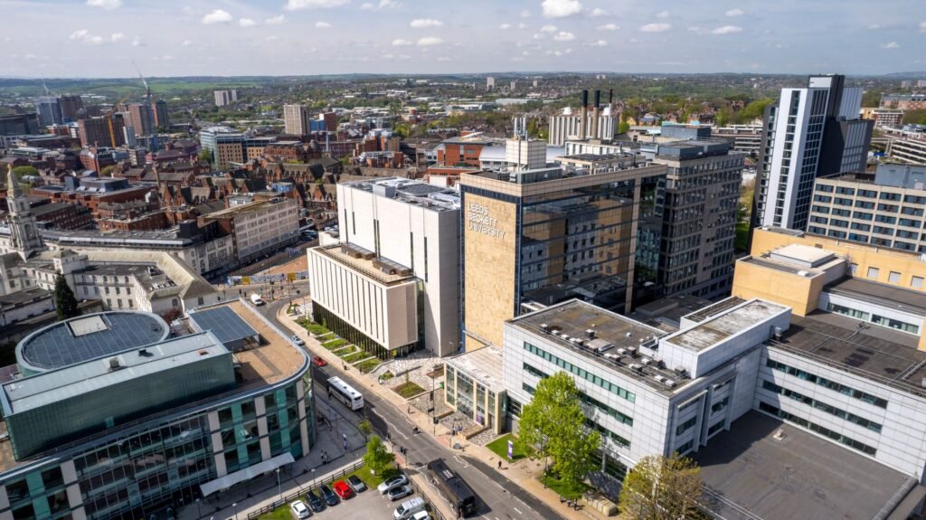 Stunning aerial view of Leeds city skyline with Leeds Beckett University buildings.
