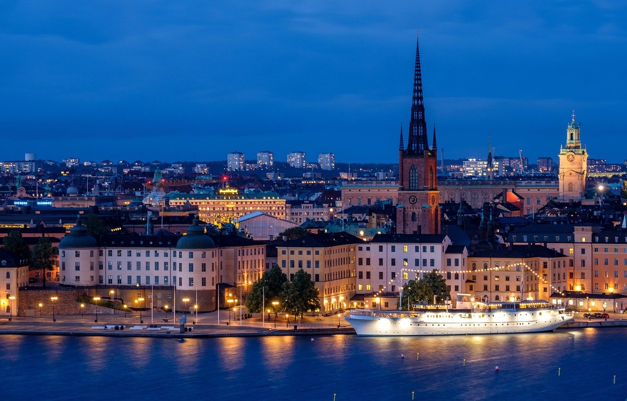 city, cityscape, waterfront, illuminated, ship, architecture, skyline, historic center, church, steeple, nature, water, sea,