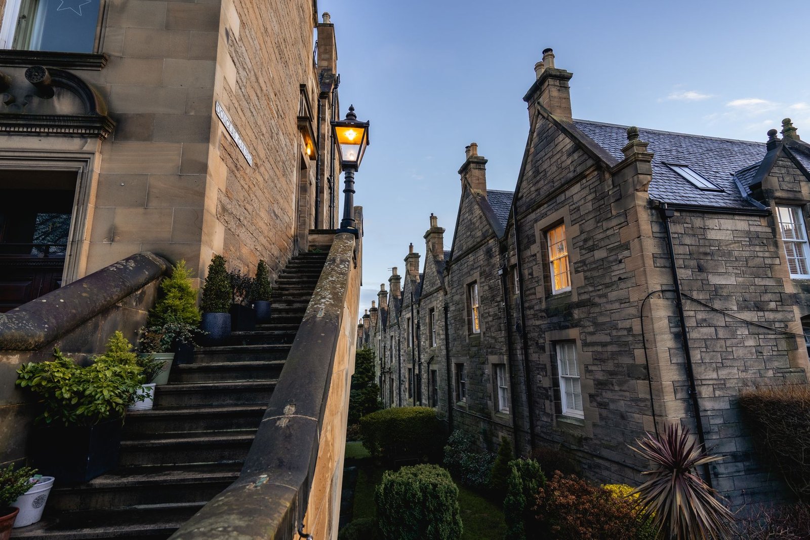 Warm evening street scene in Edinburgh with historic stone buildings