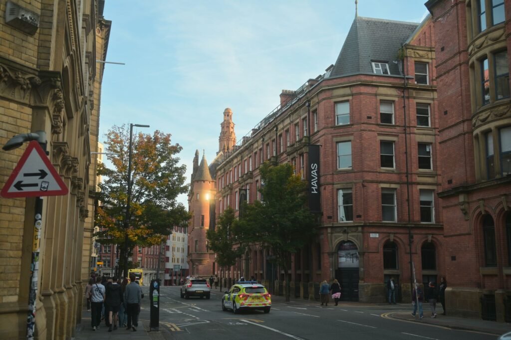 An adult traveller checking arrangements during an evening in Reading