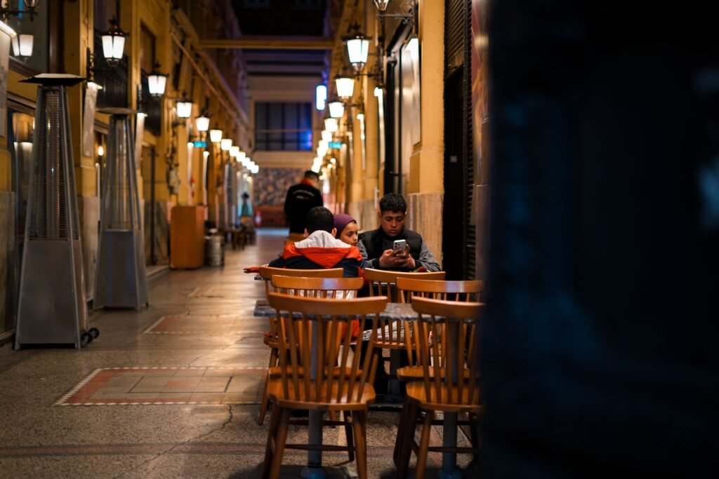 Adults discussing evening plans in a quiet café