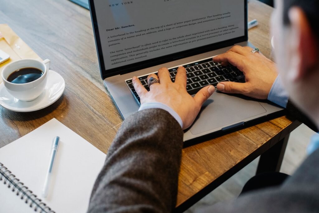 Visitor reviewing profile information on a laptop