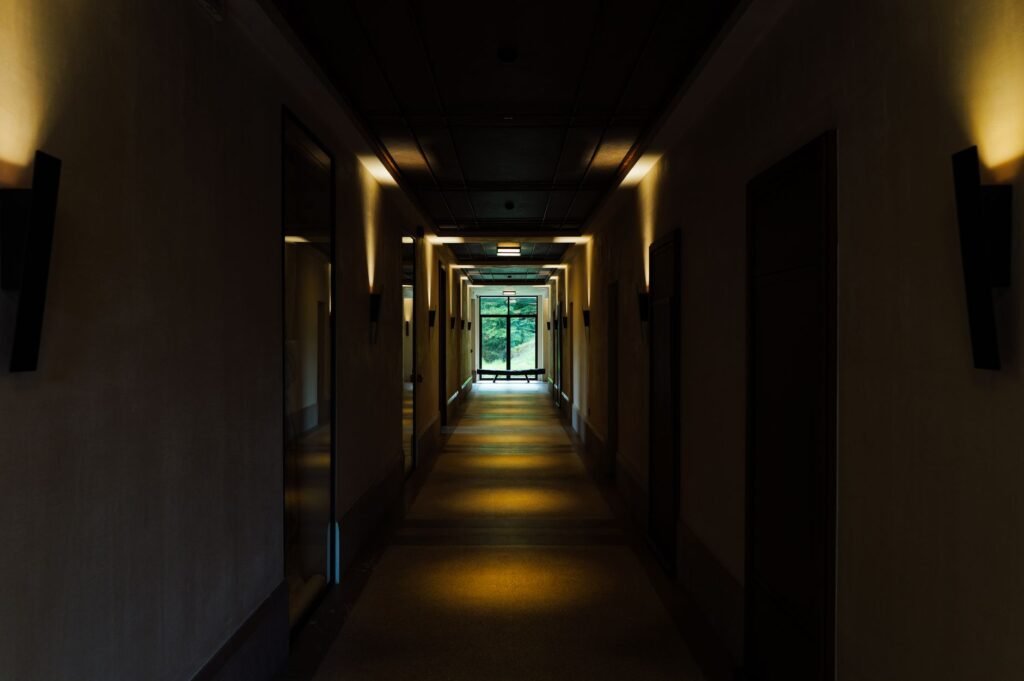 Quiet accommodation hallway representing discreet planning