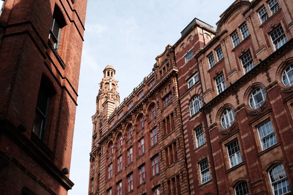 View of classic red brick architecture in the heart of Manchester, showcasing historical charm.