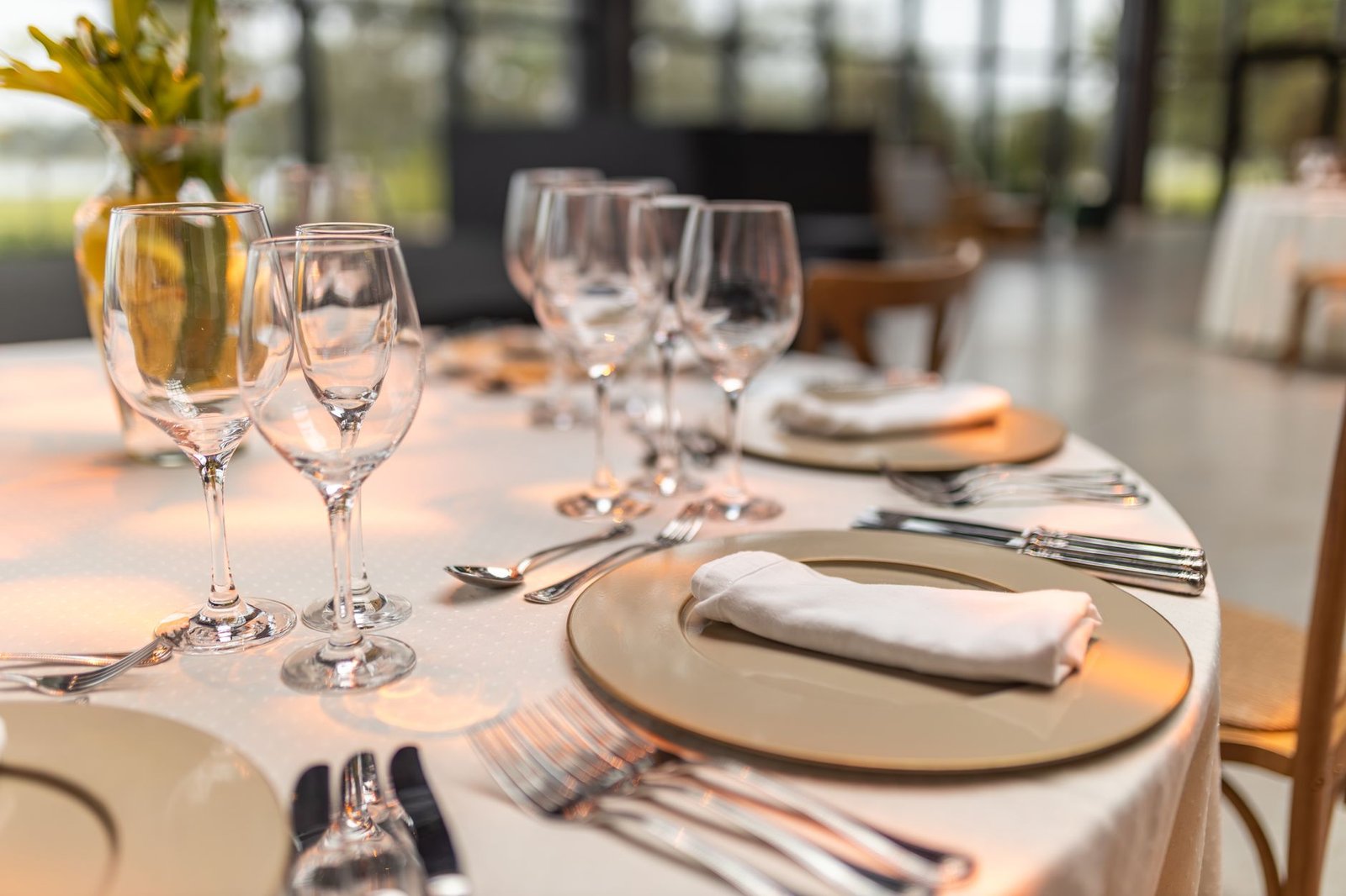 Elegant dinner table in a softly lit restaurant with live music atmosphere