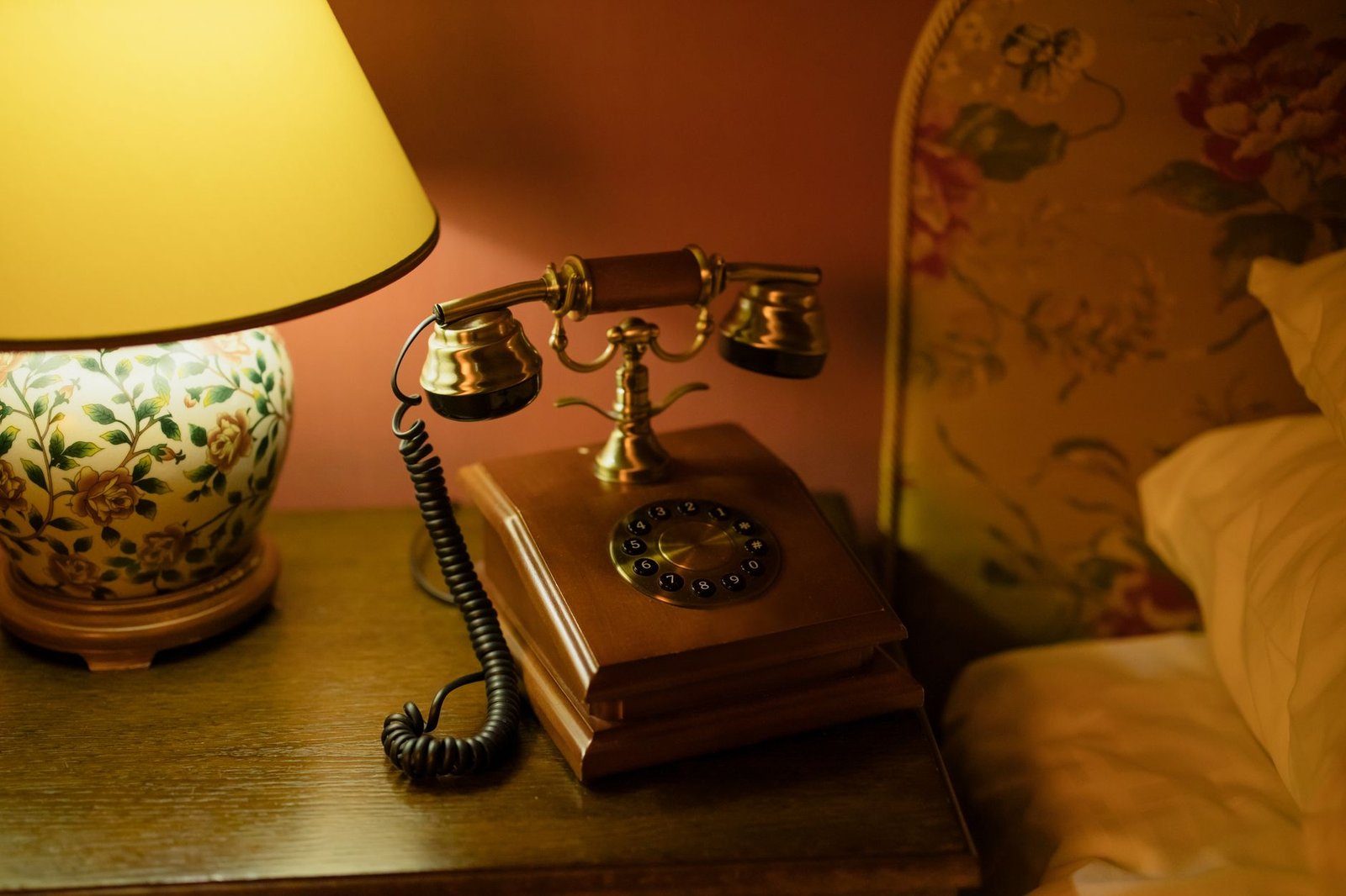 Visitor reviewing travel plans on a phone in a Bournemouth hotel room