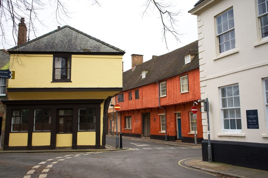 Historic architecture with colorful buildings on a quiet street in King's Lynn, England.