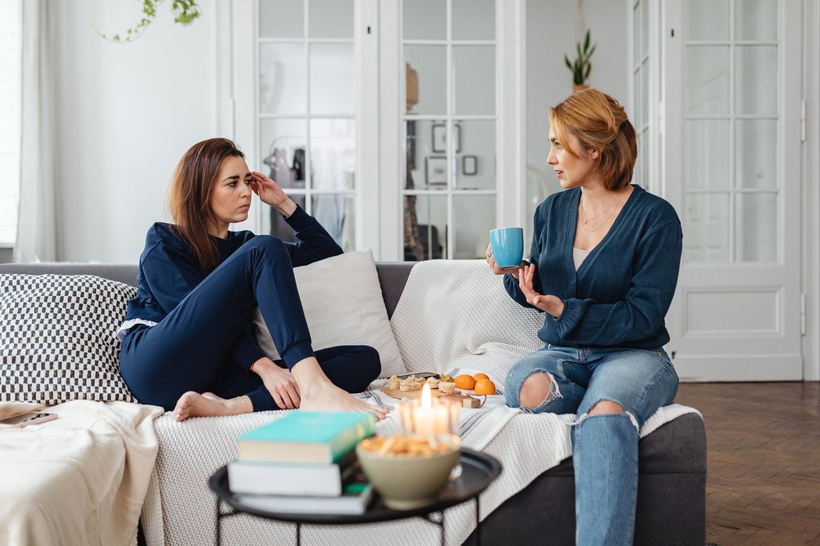 Two adults having a relaxed conversation in a contemporary lounge