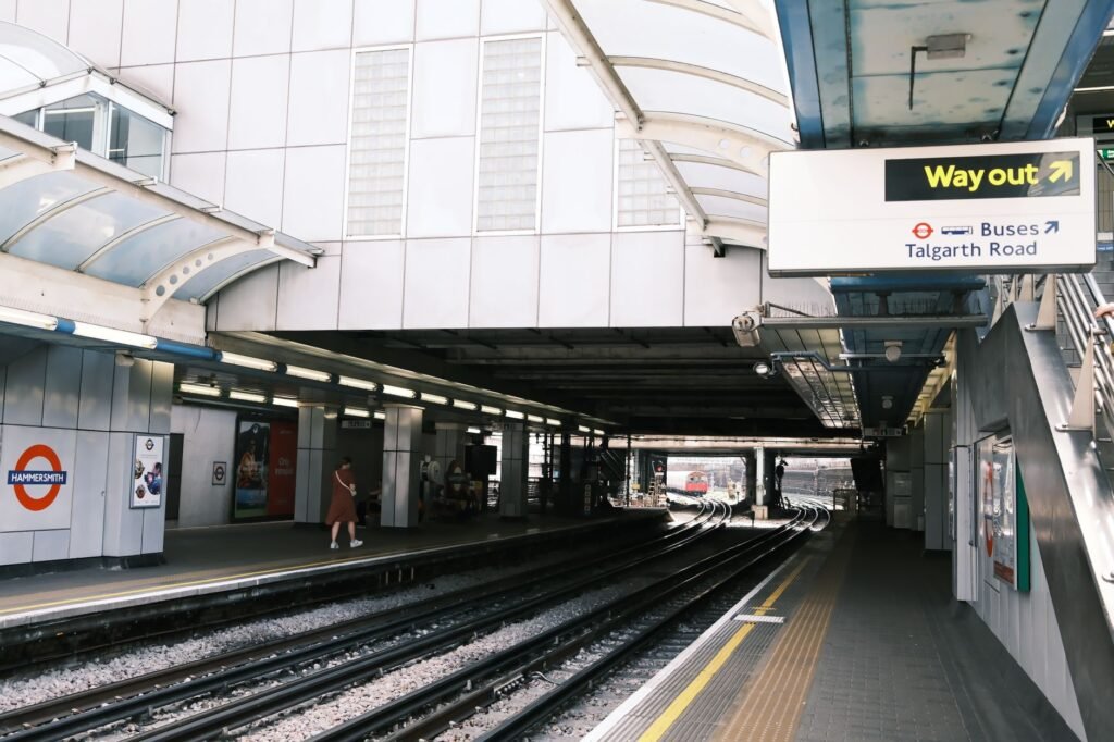Visitor checking a route near an English railway station