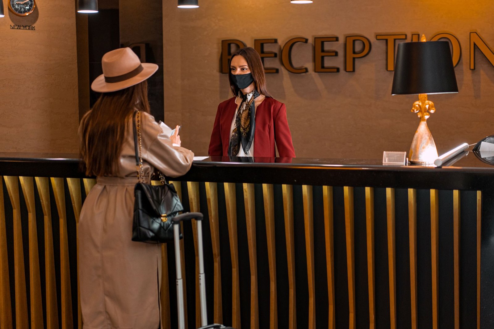 Visitor checking travel details discreetly in a modern hotel lobby