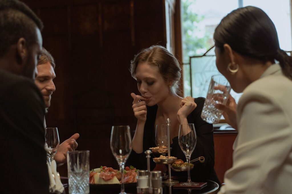 Two adults discussing plans over dinner