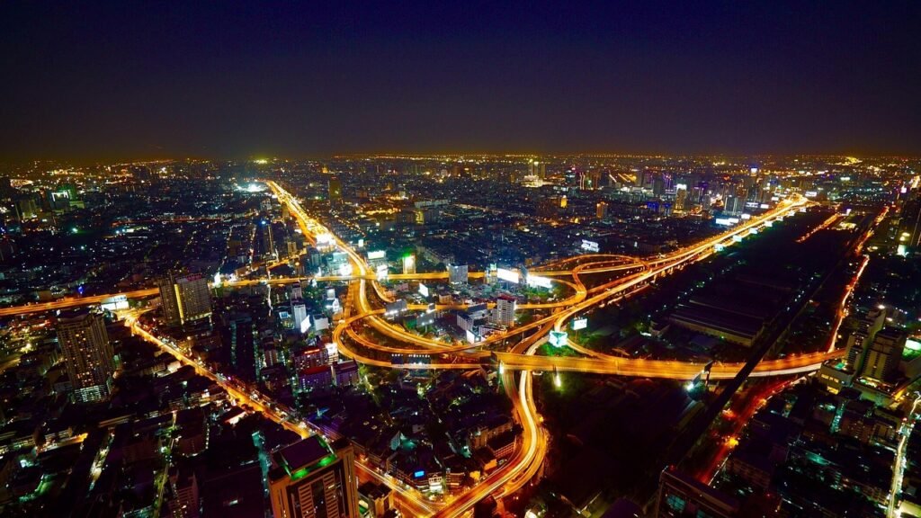 city, aerial view, illuminated, city lights, cityscape, skyline, night photography, horizon, city view, distant view, bird's