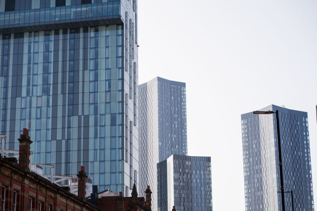 A view of modern skyscrapers in Manchester, showcasing urban architecture and city life.