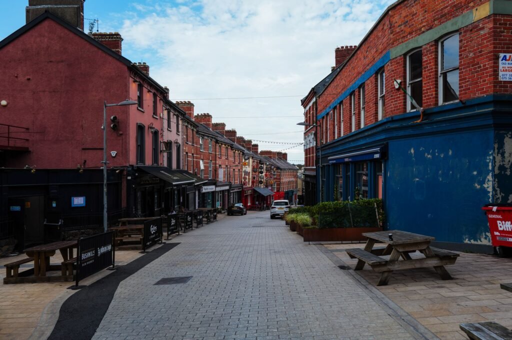 View of a vibrant city street lined with colorful historic buildings, capturing urban charm.