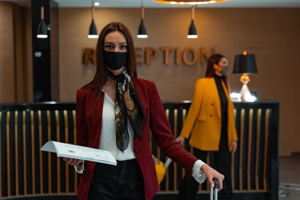 Traveller checking a phone while waiting in a hotel lobby