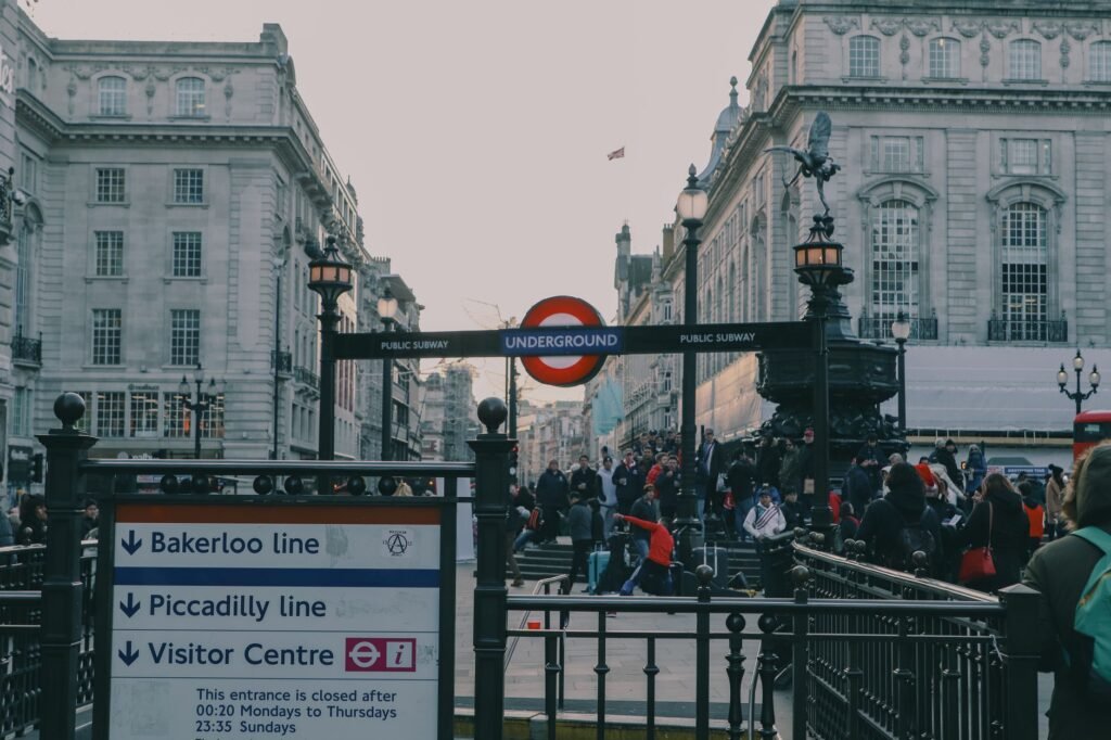 Visitor checking a travel route in London at dusk