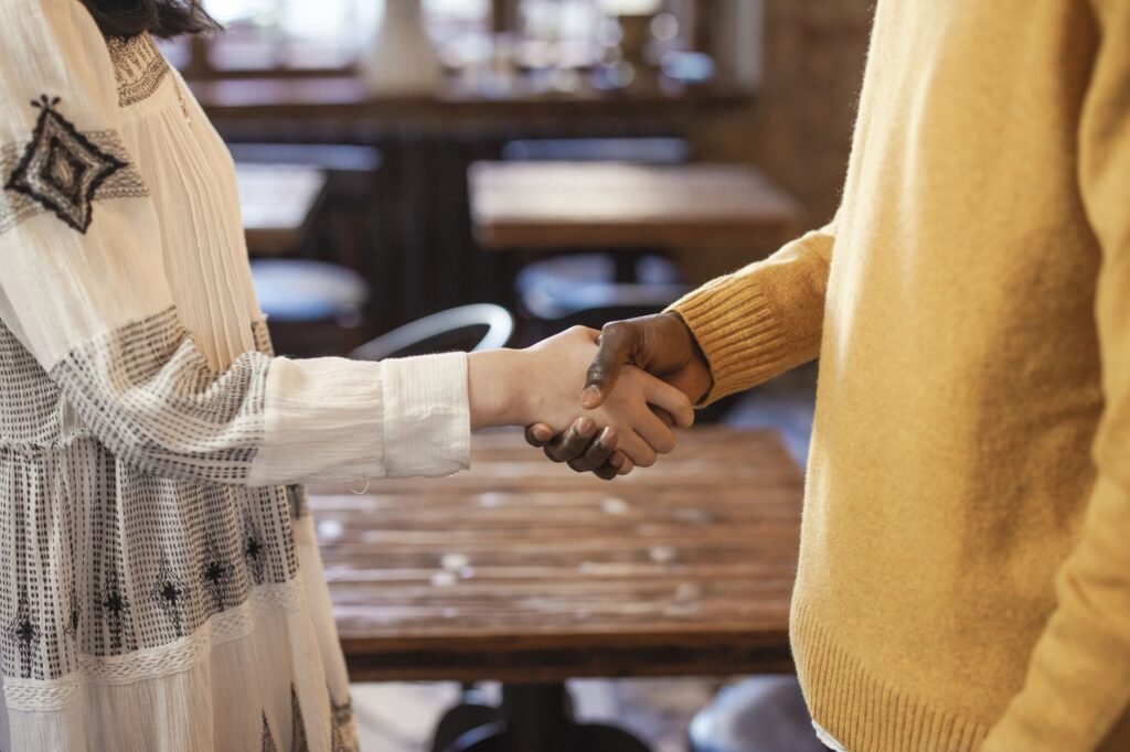 Adults discussing plans discreetly at a Bristol café