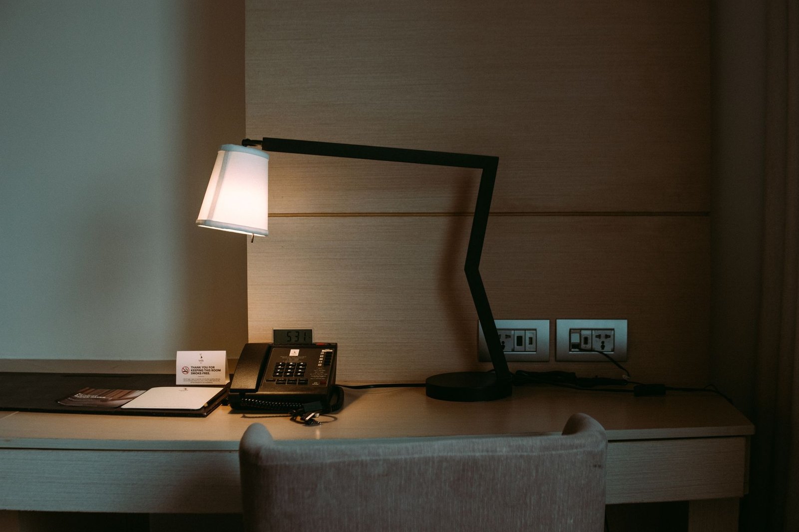 Phone and notebook prepared for a discreet appointment