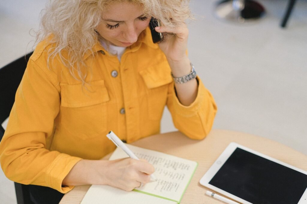 Phone and notebook used for clear booking communication