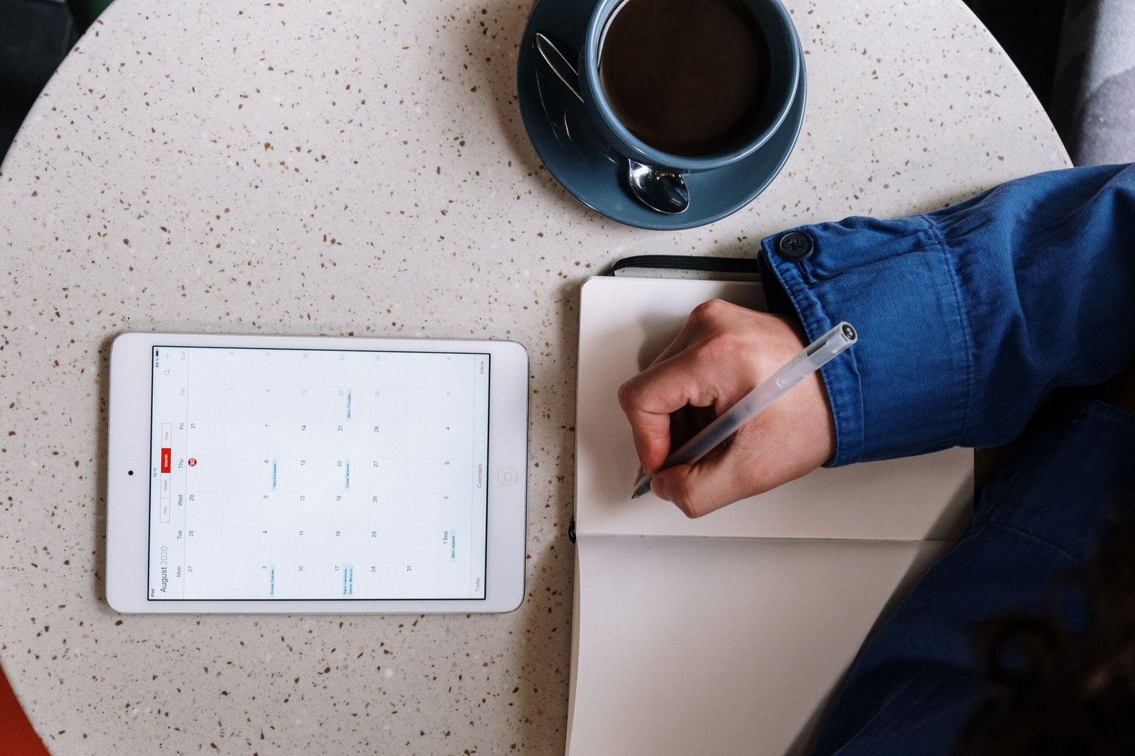 Smartphone and notebook used for planning an appointment