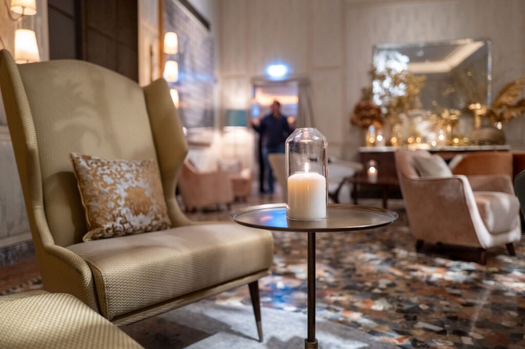 Person waiting discreetly in a quiet lounge