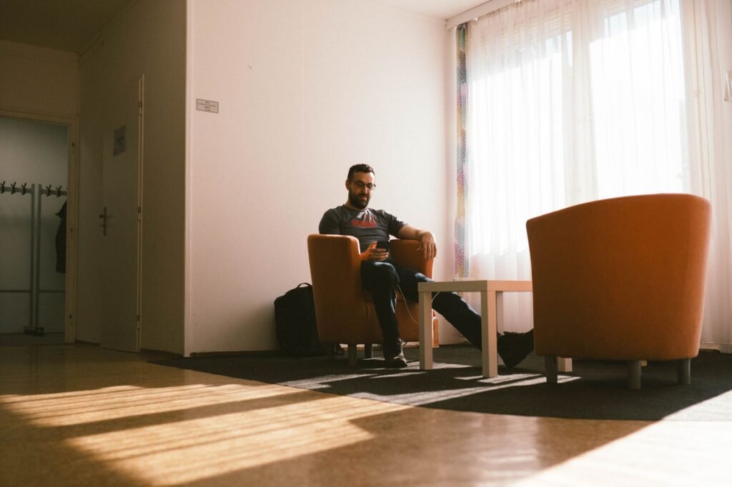Waiting discreetly with a phone in a neutral reception area