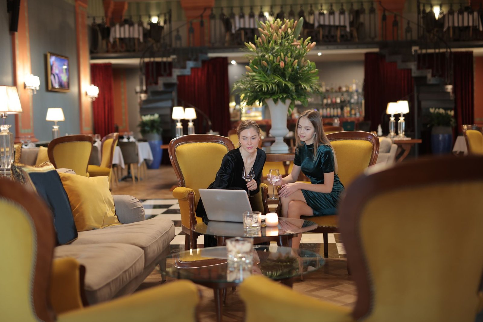 Adults having a discreet conversation in a Harrogate hotel lounge