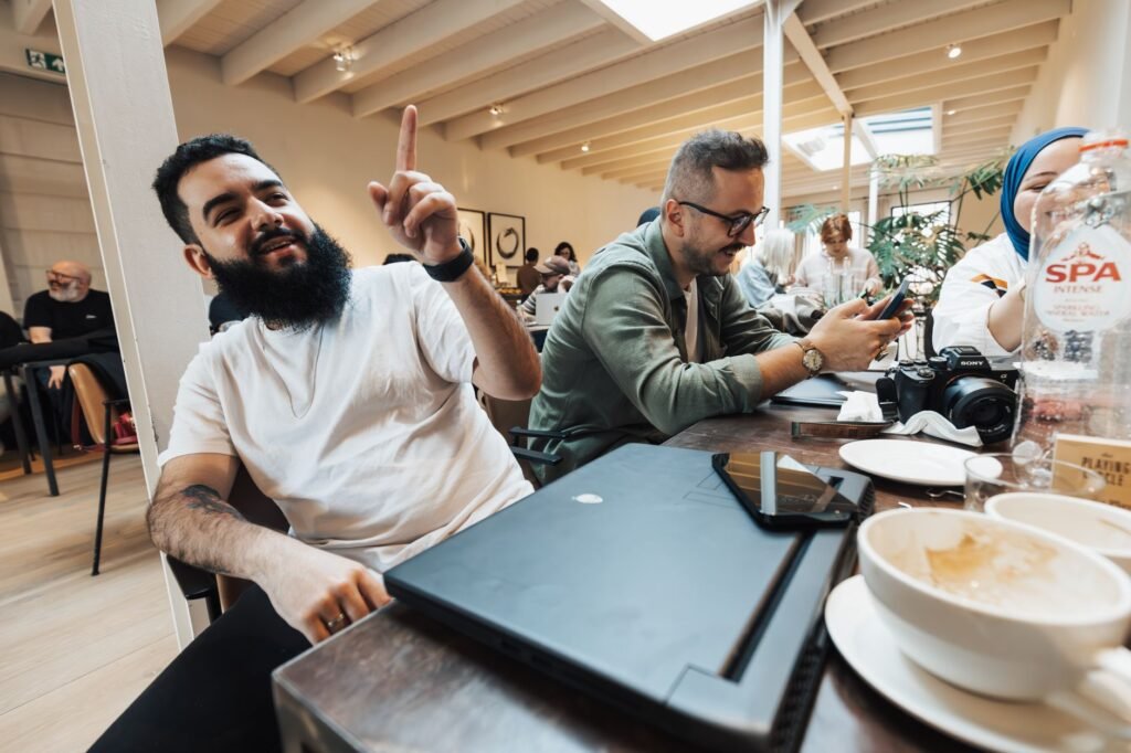 Two adults having a discreet conversation over coffee