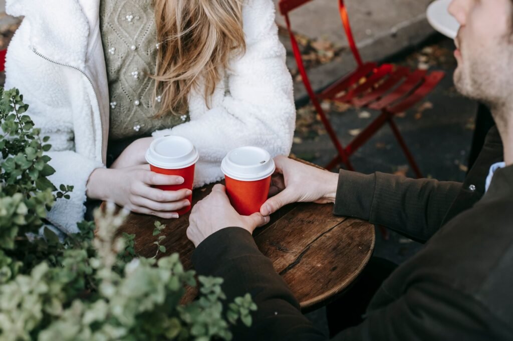 Two adults having a respectful conversation in a quiet café