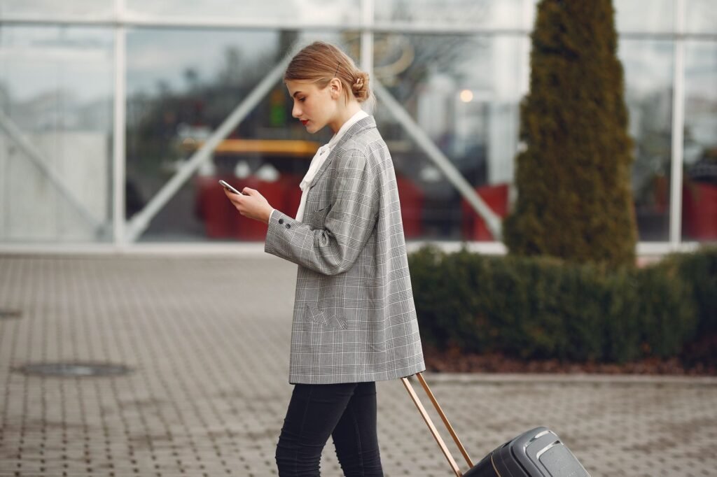 Traveller checking a smartphone before arriving for an appointment