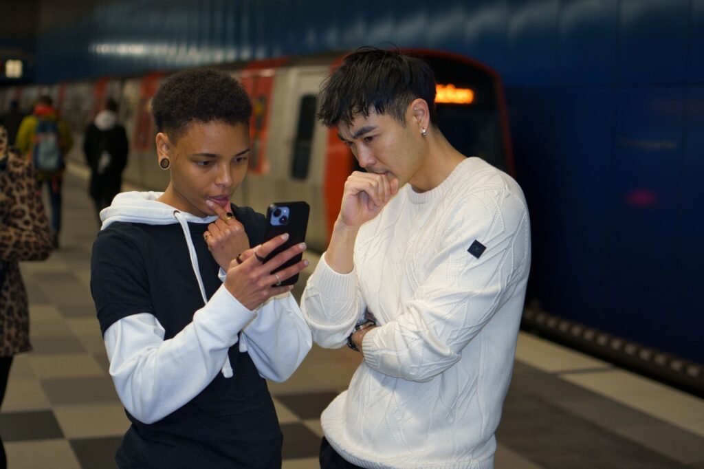 Traveller checking journey details before meeting in Oxford