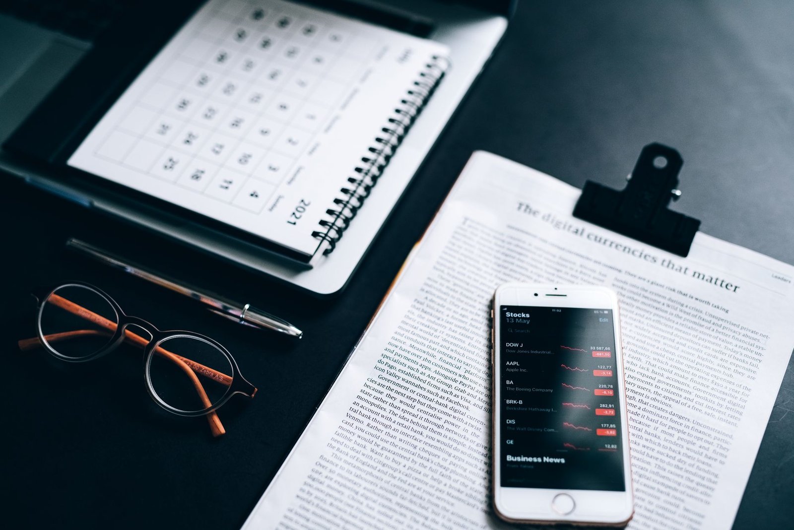 Smartphone and notebook on a private hotel room desk