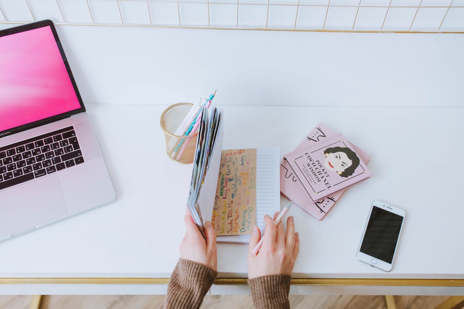 Phone and notebook beside a discreet booking checklist