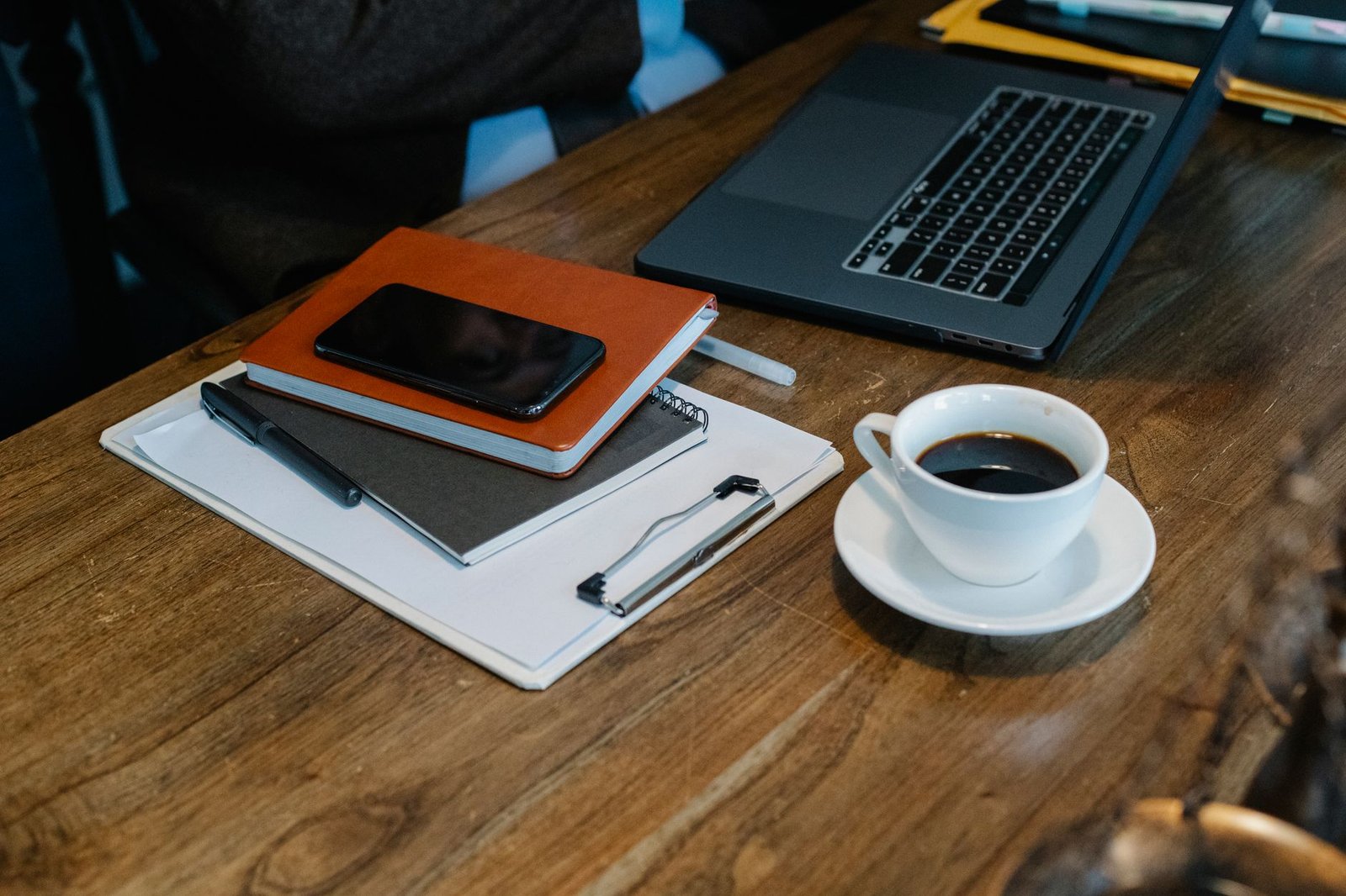 Smartphone and notebook on a discreet hotel desk