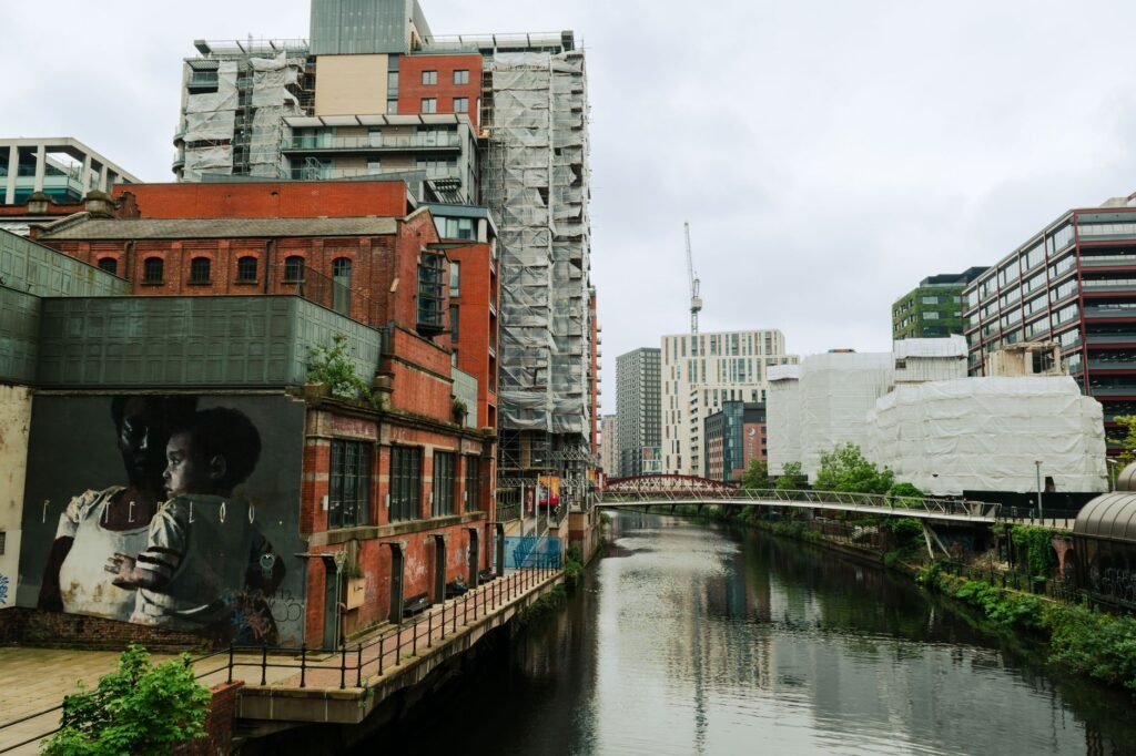 View of an urban canal surrounded by modern and historic buildings in Liverpool, England.