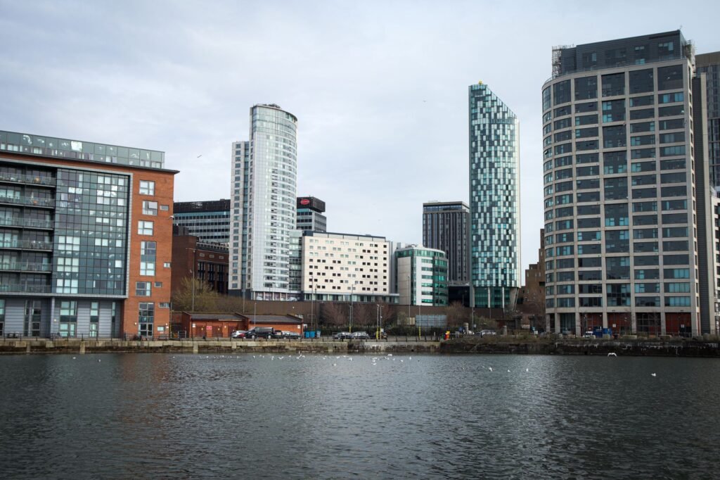 Contemporary high-rise buildings along the river in Liverpool, showcasing urban architecture.