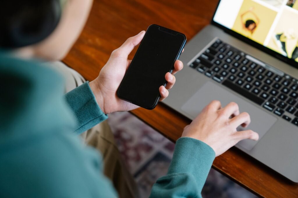 Reviewing directory profiles on a laptop and smartphone
