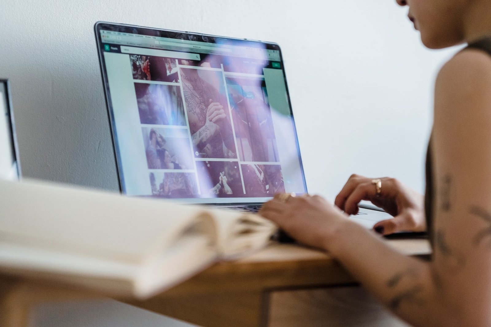 Adult browsing a directory on a laptop at a desk