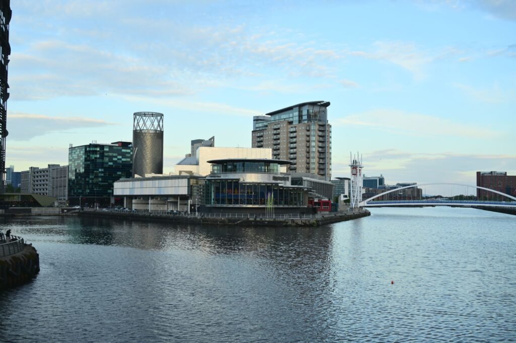 Skyline view of modern architecture along the waterfront in Manchester, UK.